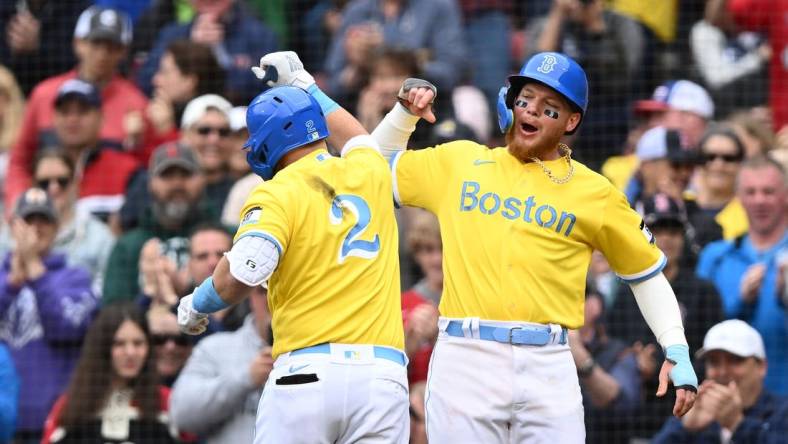 Apr 16, 2023; Boston, Massachusetts, USA; Boston Red Sox first baseman Justin Turner (2) celebrates with right fielder Alex Verdugo (99) after hitting a two run home run against the Los Angeles Angels during the third inning at Fenway Park. Mandatory Credit: Brian Fluharty-USA TODAY Sports