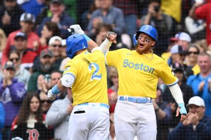 Apr 16, 2023; Boston, Massachusetts, USA; Boston Red Sox first baseman Justin Turner (2) celebrates with right fielder Alex Verdugo (99) after hitting a two run home run against the Los Angeles Angels during the third inning at Fenway Park. Mandatory Credit: Brian Fluharty-USA TODAY Sports