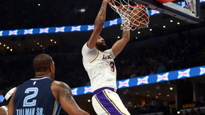 Apr 16, 2023; Memphis, Tennessee, USA; Los Angeles Lakers forward Anthony Davis (3) dunks during the first half during Game 1 of the 2023 NBA playoffs against the Memphis Grizzlies at FedExForum. Mandatory Credit: Petre Thomas-USA TODAY Sports