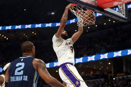 Apr 16, 2023; Memphis, Tennessee, USA; Los Angeles Lakers forward Anthony Davis (3) dunks during the first half during Game 1 of the 2023 NBA playoffs against the Memphis Grizzlies at FedExForum. Mandatory Credit: Petre Thomas-USA TODAY Sports