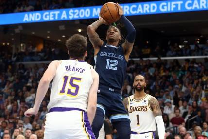 Apr 16, 2023; Memphis, Tennessee, USA; Memphis Grizzlies guard Ja Morant (12) shoots during the second half during game one of the 2023 NBA playoffs against the Los Angeles Lakers at FedExForum. Mandatory Credit: Petre Thomas-USA TODAY Sports