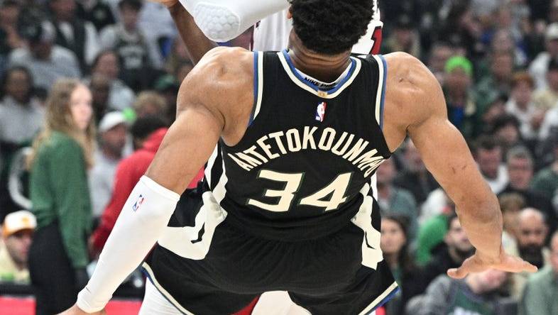 Apr 16, 2023; Milwaukee, Wisconsin, USA; Miami Heat center Bam Adebayo (13) drives against Milwaukee Bucks forward Giannis Antetokounmpo (34) in the first half during game one of the 2023 NBA Playoffs at Fiserv Forum. Mandatory Credit: Michael McLoone-USA TODAY Sports