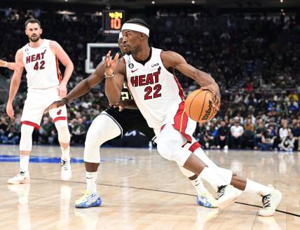 Apr 16, 2023; Milwaukee, Wisconsin, USA; Miami Heat forward Jimmy Butler (22) drives to the basket against Milwaukee Bucks guard Jrue Holiday (21) in the first half during game one of the 2023 NBA Playoffs at Fiserv Forum. Mandatory Credit: Michael McLoone-USA TODAY Sports