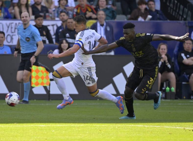 Apr 16, 2023; Carson, California, USA; Los Angeles Galaxy forward Javier Hernandez (14) control the ball defended by Los Angeles FC defender Jesus Murillo (3) in the second half at Dignity Health Sports Park. Mandatory Credit: Jayne Kamin-Oncea-USA TODAY Sports