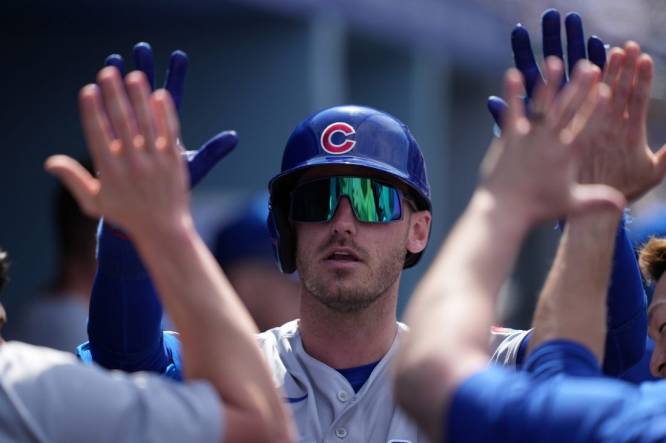Apr 16, 2023; Los Angeles, California, USA; Chicago Cubs center fielder Cody Bellinger (24) celebrates with teammates after hitting a solo home run in the fifth inning against the Los Angeles Dodgers at Dodger Stadium. Mandatory Credit: Kirby Lee-USA TODAY Sports