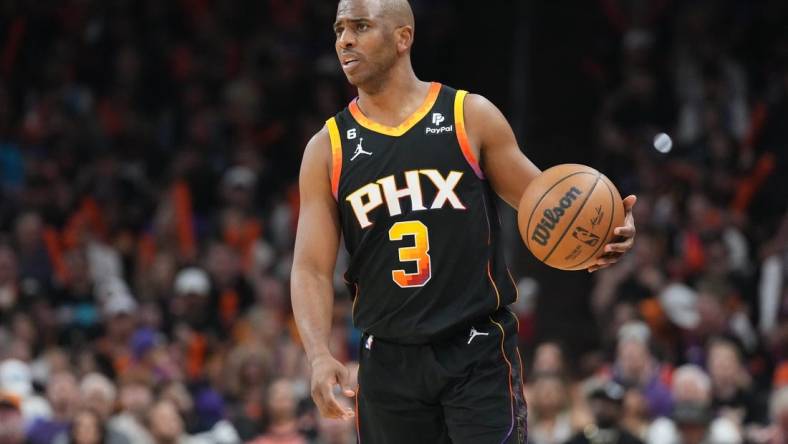 Apr 16, 2023; Phoenix, Arizona, USA; Phoenix Suns guard Chris Paul (3) dribbles against the LA Clippers during the second half of game one of the 2023 NBA playoffs at Footprint Center. Mandatory Credit: Joe Camporeale-USA TODAY Sports