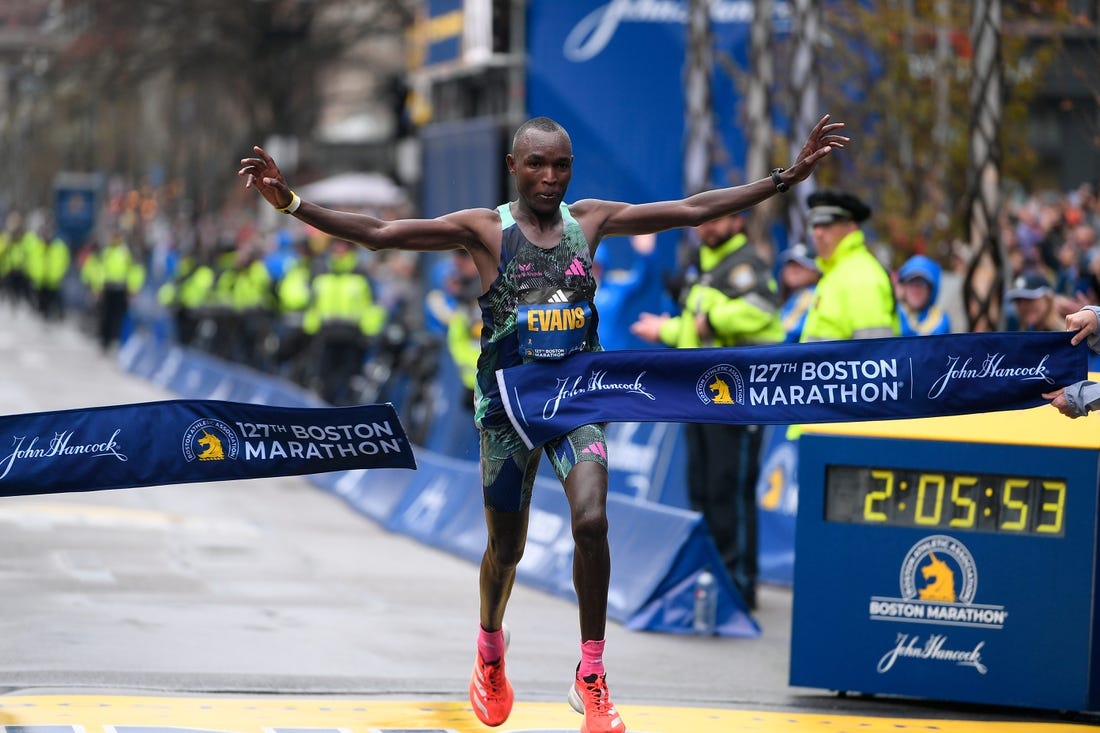 Apr 17, 2023; Boston, MA, USA; Evans Chebet of Kenya crosses the finish line to win the men's division at then 2023 Boston Marathon.  Mandatory Credit: Eric Canha-USA TODAY Sports