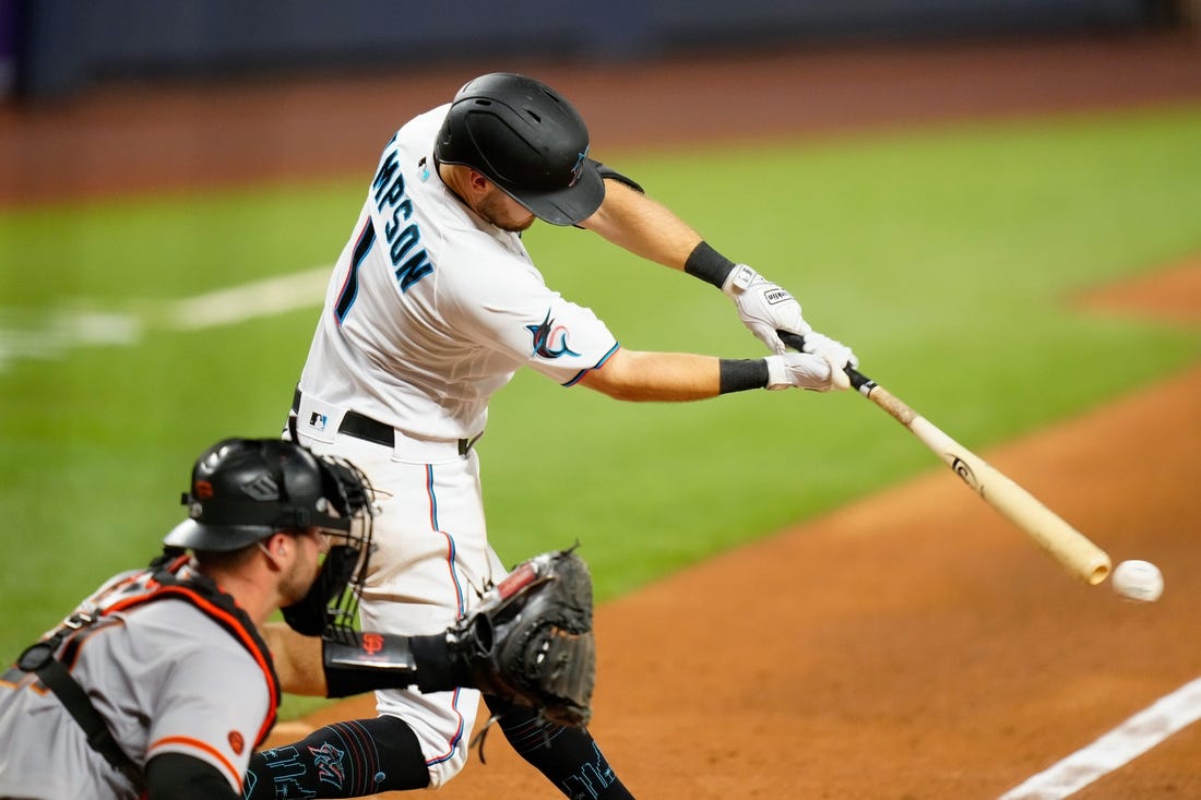 Apr 17, 2023; Miami, Florida, USA; Miami Marlins shortstop Garrett Hampson (1) hits a single against the San Francisco Giants during the sixth inning at loanDepot Park. Mandatory Credit: Rich Storry-USA TODAY Sports