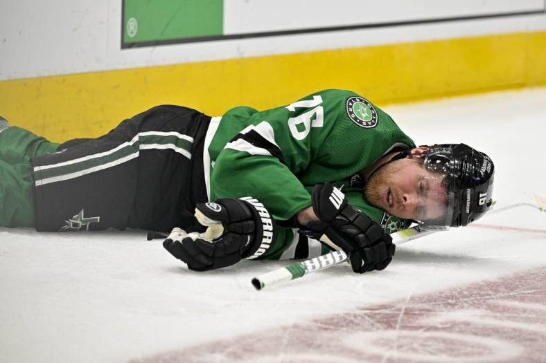 Apr 17, 2023; Dallas, Texas, USA; Dallas Stars center Joe Pavelski (16) lies on the ice after getting hit by Minnesota Wild defenseman Matt Dumba (not pictured) during the second period in game one of the first round of the 2023 Stanley Cup Playoffs at the American Airlines Center. Mandatory Credit: Jerome Miron-USA TODAY Sports