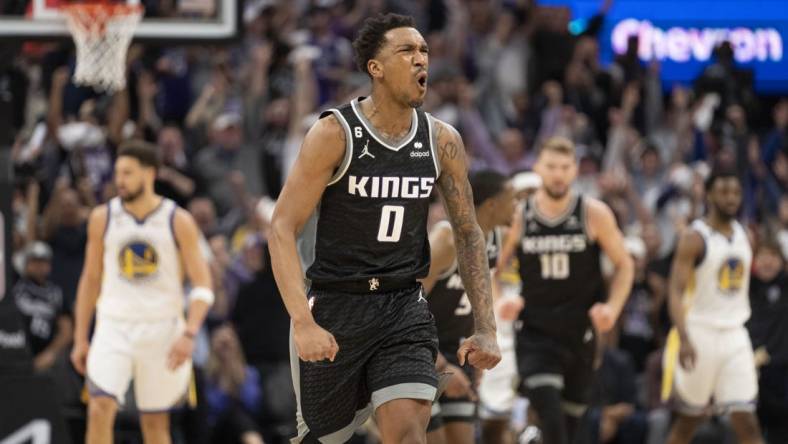 April 17, 2023; Sacramento, California, USA; Sacramento Kings guard Malik Monk (0) celebrates against the Golden State Warriors during the fourth quarter in game two of the first round of the 2023 NBA playoffs at Golden 1 Center. Mandatory Credit: Kyle Terada-USA TODAY Sports