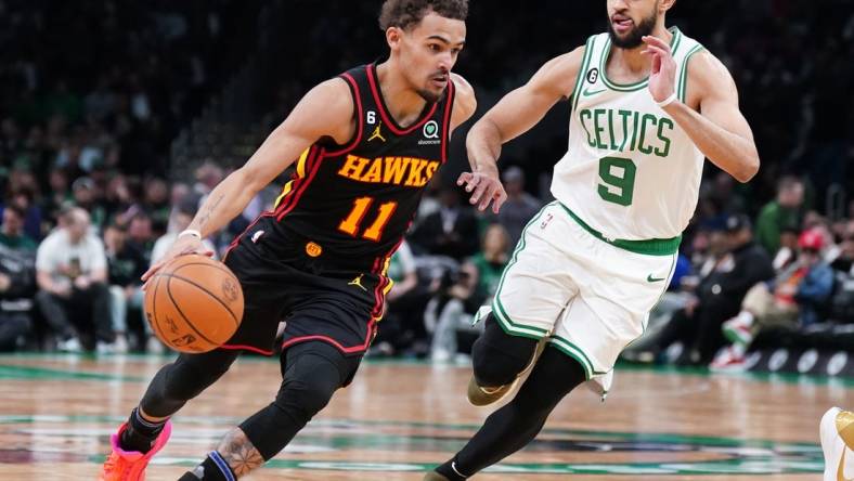 Apr 18, 2023; Boston, Massachusetts, USA; Atlanta Hawks guard Trae Young (11) drives the ball against Boston Celtics guard Derrick White (9) in the third quarter during game two of the 2023 NBA playoffs at TD Garden. Mandatory Credit: David Butler II-USA TODAY Sports