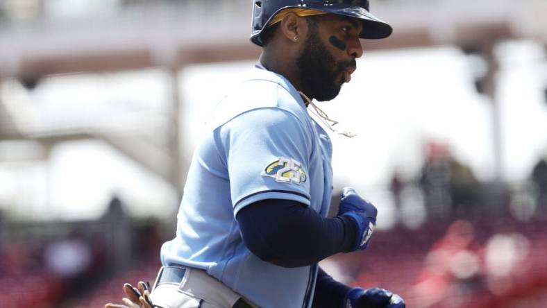 Apr 19, 2023; Cincinnati, Ohio, USA; Tampa Bay Rays first baseman Yandy Diaz (2) celebrates while running the bases after hitting a solo home run against the Cincinnati Reds during the first inning at Great American Ball Park. Mandatory Credit: David Kohl-USA TODAY Sports