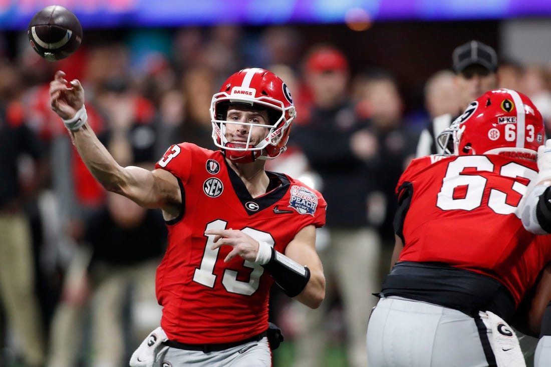 Georgia quarterback Stetson Bennett (13) throws a pass during the second half of the Chick-fil-A Peach Bowl NCAA College Football Playoff semifinal game between Ohio State and Georgia on Saturday, Dec 31, 2022, in Atlanta. Georgia won 42-41.

News Joshua L Jones

Syndication Online Athens