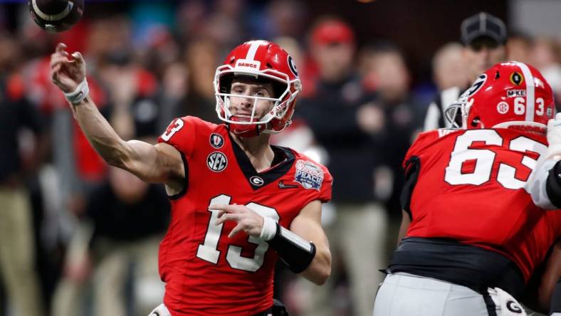 Georgia quarterback Stetson Bennett (13) throws a pass during the second half of the Chick-fil-A Peach Bowl NCAA College Football Playoff semifinal game between Ohio State and Georgia on Saturday, Dec 31, 2022, in Atlanta. Georgia won 42-41.

News Joshua L Jones

Syndication Online Athens