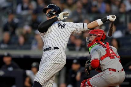 Apr 19, 2023; Bronx, New York, USA; New York Yankees center fielder Aaron Judge (99) follows through on a two run home run against the Los Angeles Angels during the first inning at Yankee Stadium. Mandatory Credit: Brad Penner-USA TODAY Sports