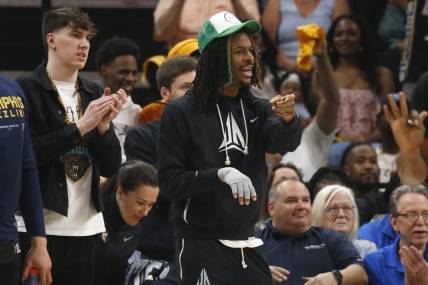 Apr 19, 2023; Memphis, Tennessee, USA; Memphis Grizzlies guard Ja Morant (12) gives direction from the bench during the first half during game two of the 2023 NBA playoffs against the Los Angeles Lakers at FedExForum. Mandatory Credit: Petre Thomas-USA TODAY Sports