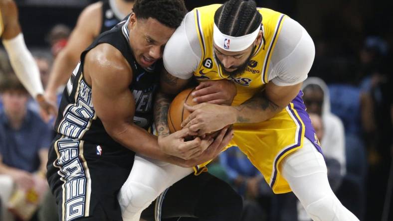 Apr 19, 2023; Memphis, Tennessee, USA; Memphis Grizzlies guard Desmond Bane (22) and Los Angeles Lakers forward Anthony Davis (3) fight for control of the ball during the first half during game two of the 2023 NBA playoffs at FedExForum. Mandatory Credit: Petre Thomas-USA TODAY Sports