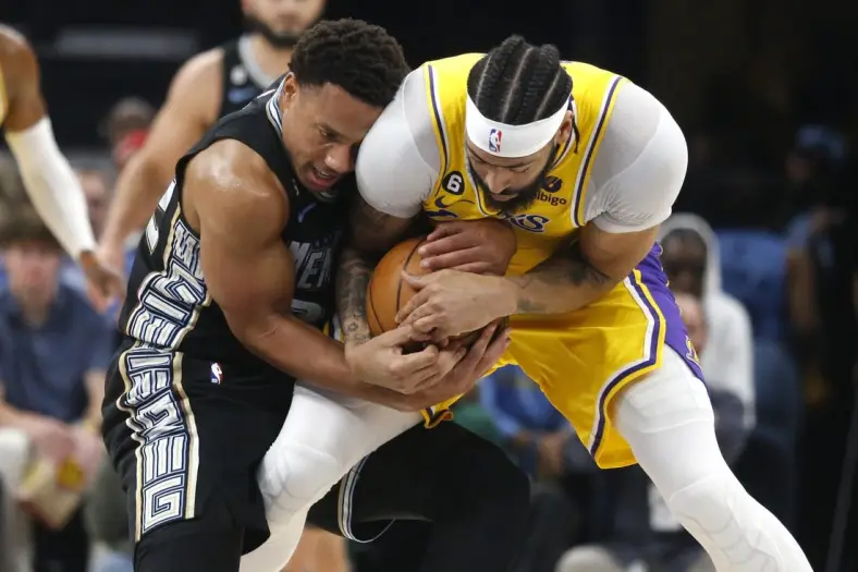 Apr 19, 2023; Memphis, Tennessee, USA; Memphis Grizzlies guard Desmond Bane (22) and Los Angeles Lakers forward Anthony Davis (3) fight for control of the ball during the first half during game two of the 2023 NBA playoffs at FedExForum. Mandatory Credit: Petre Thomas-USA TODAY Sports