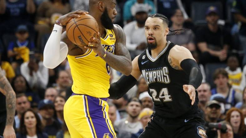 Memphis Grizzlies forward Dillon Brooks (24) defends Los Angeles Lakers forward LeBron James (6) during the second half during game two of the 2023 NBA playoffs at FedExForum. Mandatory Credit: Petre Thomas-USA TODAY Sports