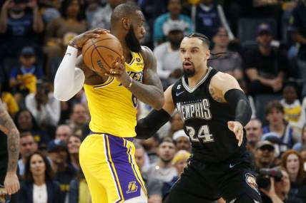 Memphis Grizzlies forward Dillon Brooks (24) defends Los Angeles Lakers forward LeBron James (6) during the second half during game two of the 2023 NBA playoffs at FedExForum. Mandatory Credit: Petre Thomas-USA TODAY Sports