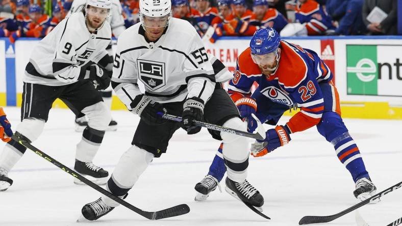 Apr 19, 2023; Edmonton, Alberta, CAN;Edmonton Oilers forward Leon Draisaitl (29) trips up Los Angeles Kings forward Quinton Byfield (55) during the second period in game two of the first round of the 2023 Stanley Cup Playoffs at Rogers Place. Mandatory Credit: Perry Nelson-USA TODAY Sports