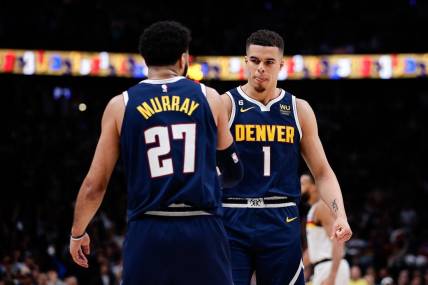 Apr 19, 2023; Denver, Colorado, USA; Denver Nuggets forward Michael Porter Jr. (1) reacts with guard Jamal Murray (27) in the fourth quarter during game two of the 2023 NBA Playoffs at Ball Arena. Mandatory Credit: Isaiah J. Downing-USA TODAY Sports