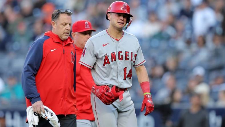 Apr 20, 2023; Bronx, New York, USA; Los Angeles Angels catcher Logan O'Hoppe (14) reacts as he leaves the game after injuring himself on a swing during the ninth inning against the New York Yankees at Yankee Stadium. Mandatory Credit: Brad Penner-USA TODAY Sports