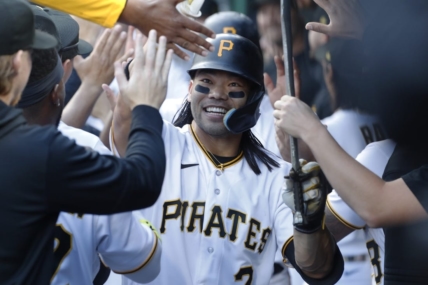 Apr 20, 2023; Pittsburgh, Pennsylvania, USA;  Pittsburgh Pirates right fielder Connor Joe (2) celebrates in the dugout after hitting a three run home run against the Cincinnati Reds during the first inning at PNC Park. Mandatory Credit: Charles LeClaire-USA TODAY Sports