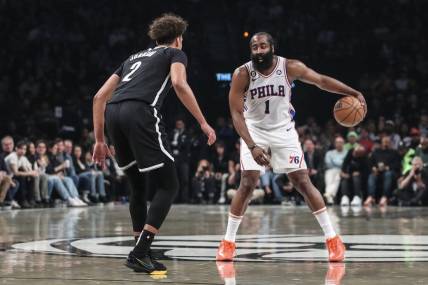 Apr 20, 2023; Brooklyn, New York, USA; Philadelphia 76ers guard James Harden (1) looks to drive past Brooklyn Nets forward Cameron Johnson (2) during game three of the 2023 NBA playoffs at Barclays Center. Mandatory Credit: Wendell Cruz-USA TODAY Sports