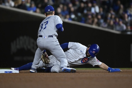 Apr 20, 2023; Chicago, Illinois, USA;  Chicago Cubs shortstop Dansby Swanson (7) slides safely into second base under Los Angeles Dodgers right fielder Luke Williams (37) during the first inning at Wrigley Field. Mandatory Credit: Matt Marton-USA TODAY Sports