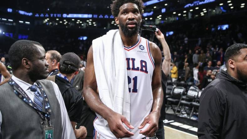 Apr 20, 2023; Brooklyn, New York, USA; Philadelphia 76ers center Joel Embiid (21) walks off the court after defeating the against the Brooklyn Nets 102-97 in game three of the 2023 NBA playoffs at Barclays Center. Mandatory Credit: Wendell Cruz-USA TODAY Sports