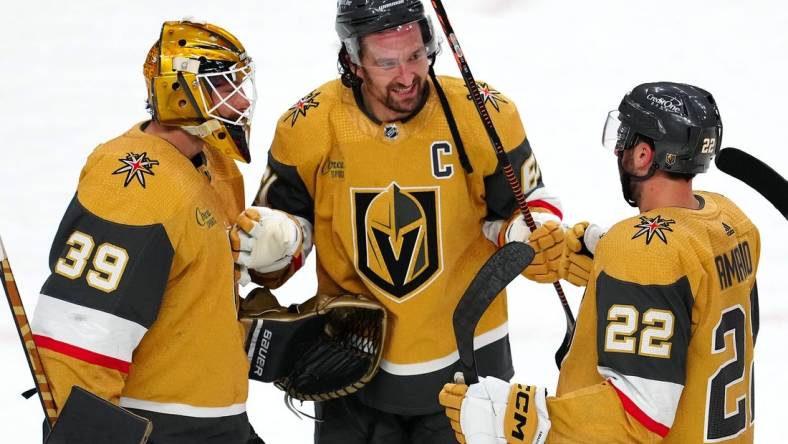 Apr 20, 2023; Las Vegas, Nevada, USA; Vegas Golden Knights forward Mark Stone (61) celebrates with goaltender Laurent Brossoit (39) and right wing Michael Amadio (22) after defeating the Winnipeg Jets 5-2 in game two of the first round of the 2023 Stanley Cup Playoffs at T-Mobile Arena. Mandatory Credit: Stephen R. Sylvanie-USA TODAY Sports