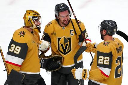 Apr 20, 2023; Las Vegas, Nevada, USA; Vegas Golden Knights forward Mark Stone (61) celebrates with goaltender Laurent Brossoit (39) and right wing Michael Amadio (22) after defeating the Winnipeg Jets 5-2 in game two of the first round of the 2023 Stanley Cup Playoffs at T-Mobile Arena. Mandatory Credit: Stephen R. Sylvanie-USA TODAY Sports