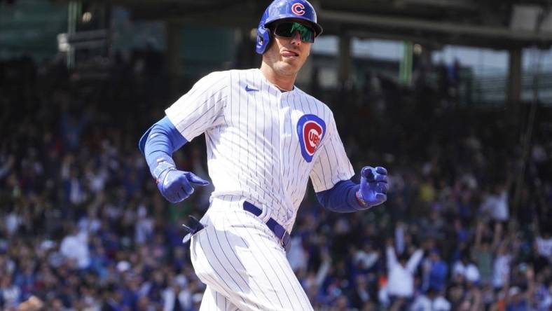 Apr 21, 2023; Chicago, Illinois, USA; Chicago Cubs center fielder Cody Bellinger (24) looks at the Los Angeles Dodgers dugout after hitting a home run during the third inning at Wrigley Field. Mandatory Credit: David Banks-USA TODAY Sports