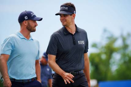Apr 21, 2023; Avondale, Louisiana, USA; Wyndham Clark and Beau Hossler walk the eighth fairway during the second round of the Zurich Classic of New Orleans golf tournament. Mandatory Credit: Andrew Wevers-USA TODAY Sports
