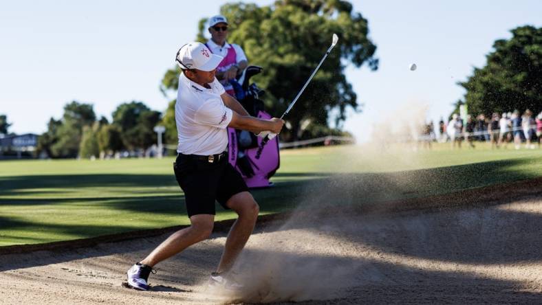 Apr 22, 2023; Adelaide,South Australia, AUS; Talor Gooch of Team Rangegoats hits a bunker shot during the second round of LIV Golf Adelaide golf tournament at Grange Golf Club. Mandatory Credit: Mike Frey-USA TODAY Sports