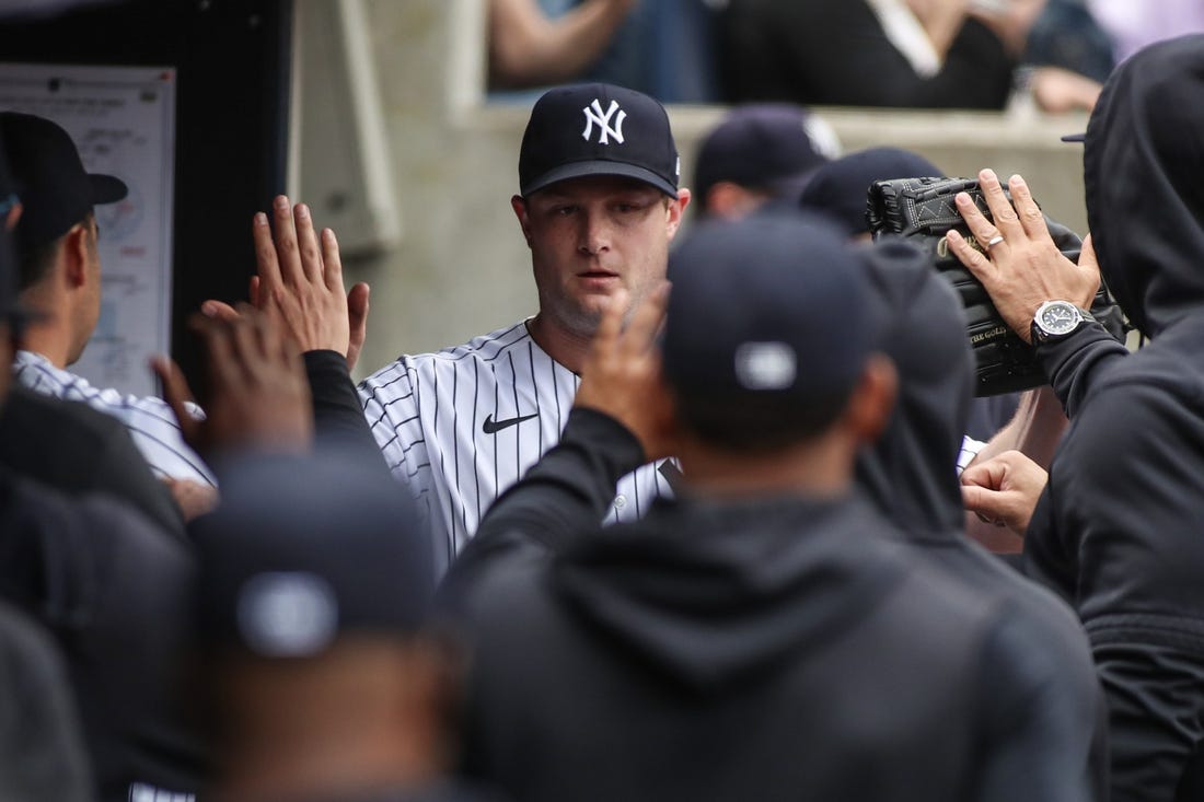 Apr 22, 2023; Bronx, New York, USA;  New York Yankees starting pitcher Gerrit Cole (45) is greeted in the dugout after being taken out in the sixth inning against the Toronto Blue Jays at Yankee Stadium. Mandatory Credit: Wendell Cruz-USA TODAY Sports