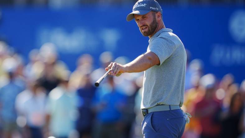 Apr 22, 2023; Avondale, Louisiana, USA; Wyndham Clark talks on the 18th green during the third round of the Zurich Classic of New Orleans golf tournament. Mandatory Credit: Andrew Wevers-USA TODAY Sports