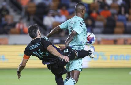 Apr 22, 2023; Houston, Texas, USA; Houston Dynamo FC midfielder Hector Herrera (16) attempts to control the ball away from Inter Miami CF midfielder Dixon Arroyo (3) during the first half at Shell Energy Stadium. Mandatory Credit: Troy Taormina-USA TODAY Sports