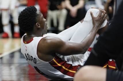 Apr 22, 2023; Miami, Florida, USA; Miami Heat guard Victor Oladipo (4) reacts after getting injured in the fourth quarter against the Milwaukee Bucks during game three of the 2023 NBA Playoffs at Kaseya Center. Mandatory Credit: Sam Navarro-USA TODAY Sports