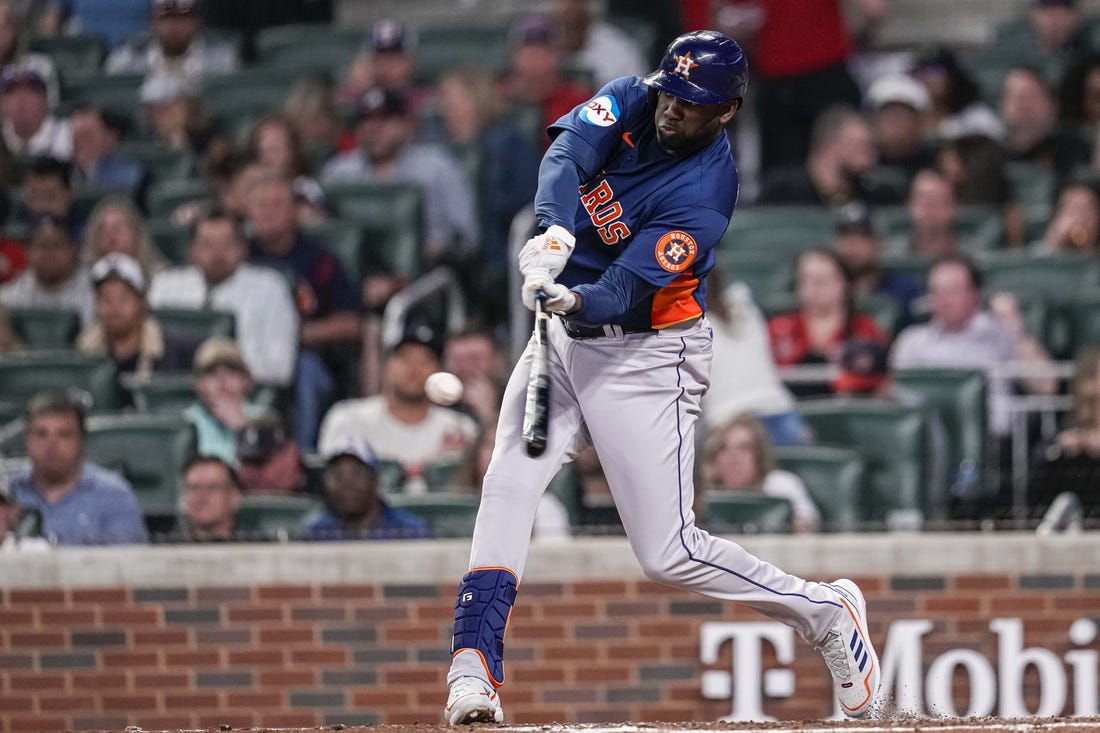 Apr 22, 2023; Cumberland, Georgia, USA; Houston Astros designated hitter Yordan Alvarez (44) hits a two run home run against the Atlanta Braves during the sixth inning at Truist Park. Mandatory Credit: Dale Zanine-USA TODAY Sports