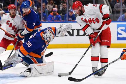 Apr 23, 2023; Elmont, New York, USA; Carolina Hurricanes right wing Stefan Noesen (23) plays the puck in front of New York Islanders goaltender Ilya Sorokin (30) during the first period in game four of the first round of the 2023 Stanley Cup Playoffs at UBS Arena. Mandatory Credit: Dennis Schneidler-USA TODAY Sports