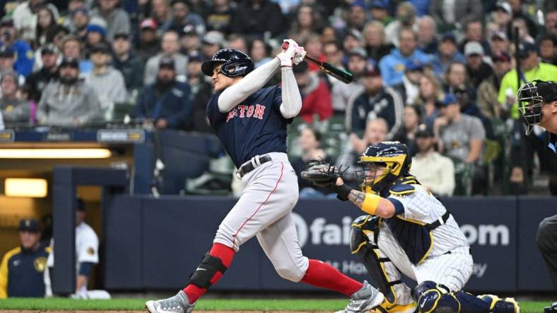 Apr 23, 2023; Milwaukee, Wisconsin, USA; Boston Red Sox shortstop Yu Chang (20) at bat against the Milwaukee Brewers in the second inning at American Family Field. Mandatory Credit: Michael McLoone-USA TODAY Sports