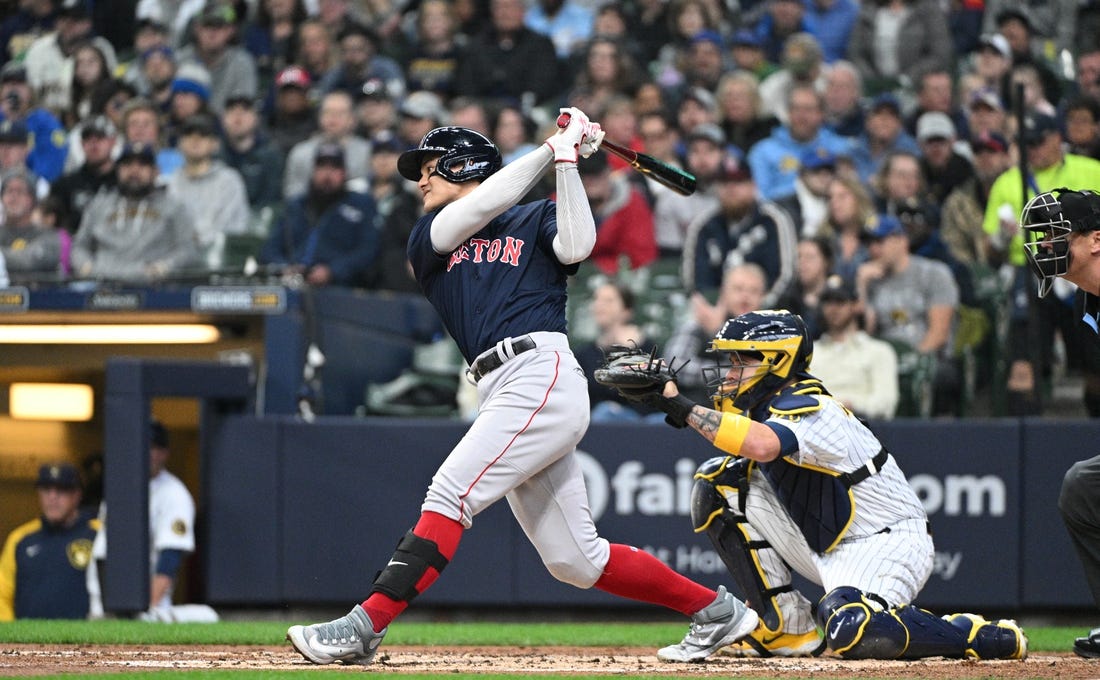 Apr 23, 2023; Milwaukee, Wisconsin, USA; Boston Red Sox shortstop Yu Chang (20) at bat against the Milwaukee Brewers in the second inning at American Family Field. Mandatory Credit: Michael McLoone-USA TODAY Sports