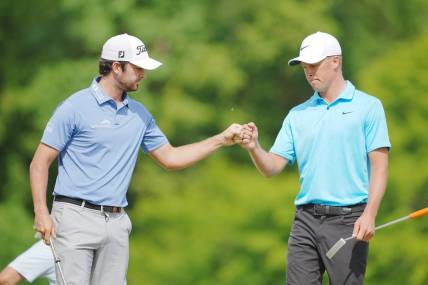 Apr 23, 2023; Avondale, Louisiana, USA; Davis Riley fist bumps Nick Hardy on the 16th green during the final round of the Zurich Classic of New Orleans golf tournament. Mandatory Credit: Andrew Wevers-USA TODAY Sports
