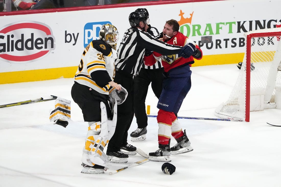 Apr 23, 2023; Sunrise, Florida, USA; Florida Panthers left wing Matthew Tkachuk (19) and Boston Bruins goaltender Linus Ullmark (35) are separated by the linesmen after a line brawl during the third period of game four in the first round of the 2023 Stanley Cup Playoffs at FLA Live Arena. Mandatory Credit: Jasen Vinlove-USA TODAY Sports