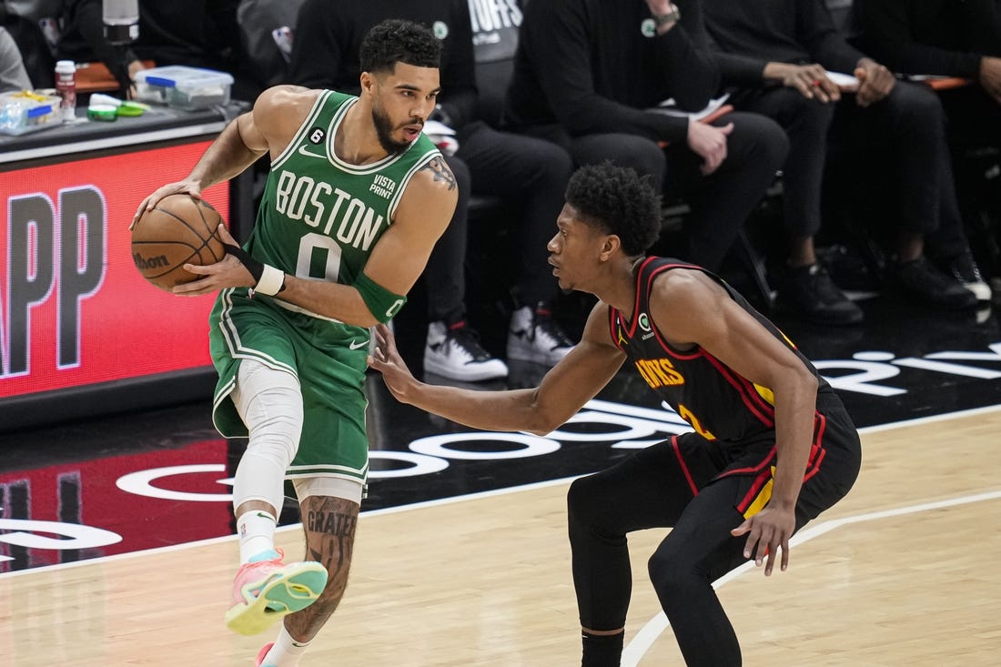 Apr 23, 2023; Atlanta, Georgia, USA; Boston Celtics forward Jayson Tatum (0) controls the ball against Atlanta Hawks forward De'Andre Hunter (12) during the first quarter during game four of the 2023 NBA playoffs at State Farm Arena. Mandatory Credit: Dale Zanine-USA TODAY Sports