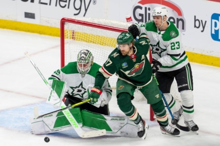 Apr 21, 2023; Saint Paul, Minnesota, USA; Minnesota Wild left wing Marcus Foligno (17) and Dallas Stars defenseman Esa Lindell (23) and goaltender Jake Oettinger (29) in the first period of game three of the first round of the 2023 Stanley Cup Playoffs at Xcel Energy Center. Mandatory Credit: Matt Blewett-USA TODAY Sports