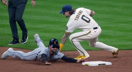 Apr 24, 2023; Milwaukee, Wisconsin, USA; Milwaukee Brewers second baseman Brice Turang (0) tags Detroit Tigers catcher Eric Haase (13) while trying to steal second base during the third inning at American Family Field. Mandatory Credit: Mark Hoffman-USA TODAY Sports