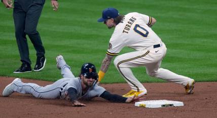 Apr 24, 2023; Milwaukee, Wisconsin, USA; Milwaukee Brewers second baseman Brice Turang (0) tags Detroit Tigers catcher Eric Haase (13) while trying to steal second base during the third inning at American Family Field. Mandatory Credit: Mark Hoffman-USA TODAY Sports